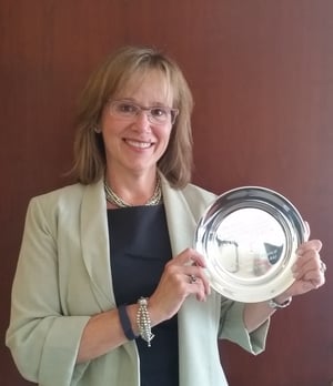 Linda holding EJC award
